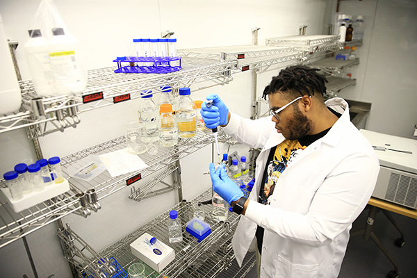 BSU chemistry student Fegens Lyncee working in a lab