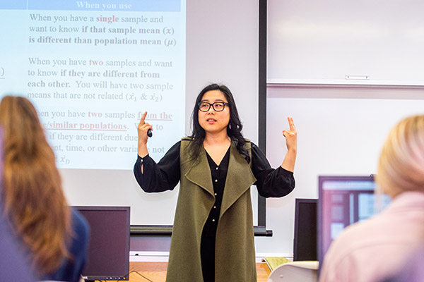Professor Hannarae Lee teaching a class on analyzing criminal data