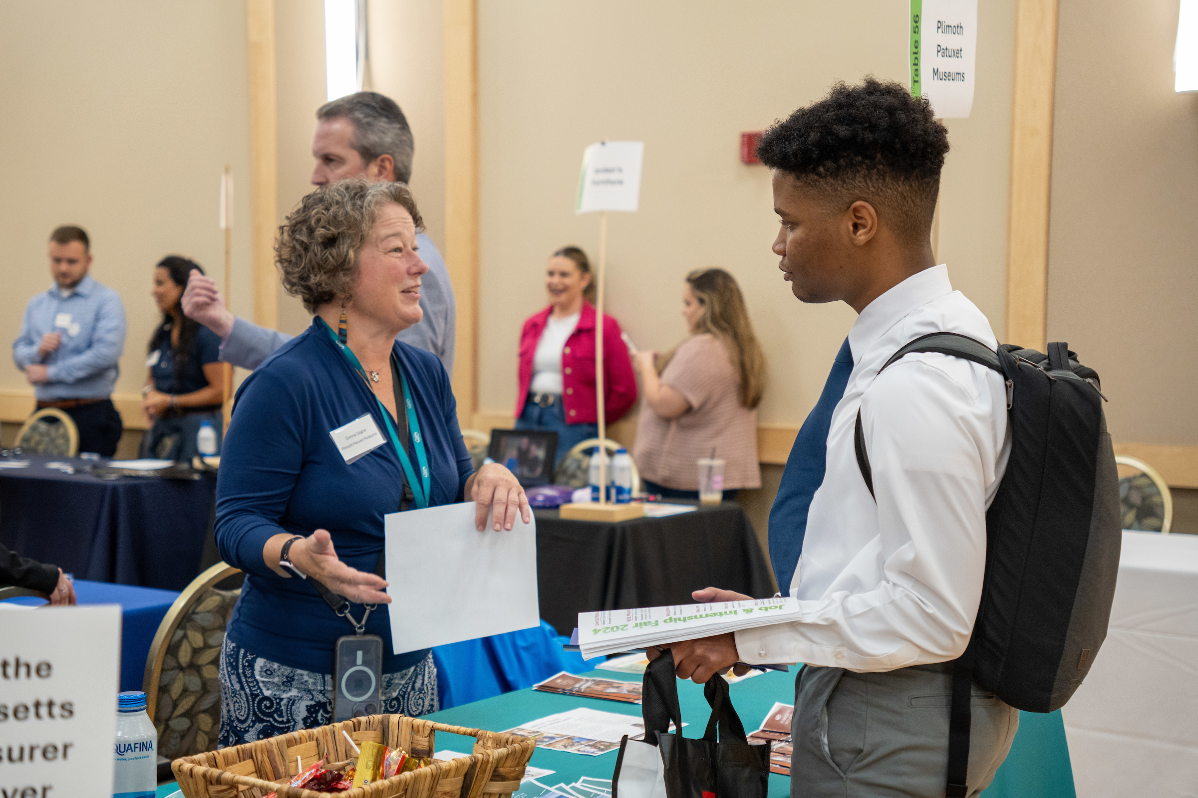 A BSU student speaks to a representative from Plimoth Patuxet Museums at BSU Job and Internship Fair