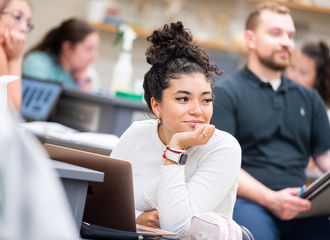 A student looks pensive in class