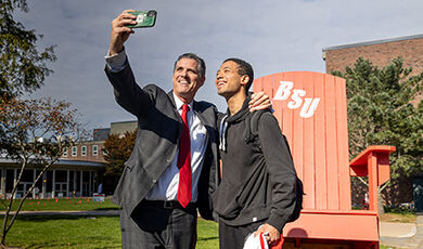 President Clark takes a selfie with a student