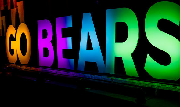 large light up capital letters that say GO BEARS in rainbow colors