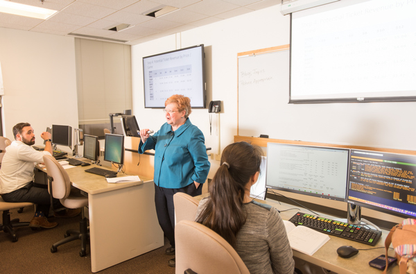 Dr. Marian Extjet teaching a Management class