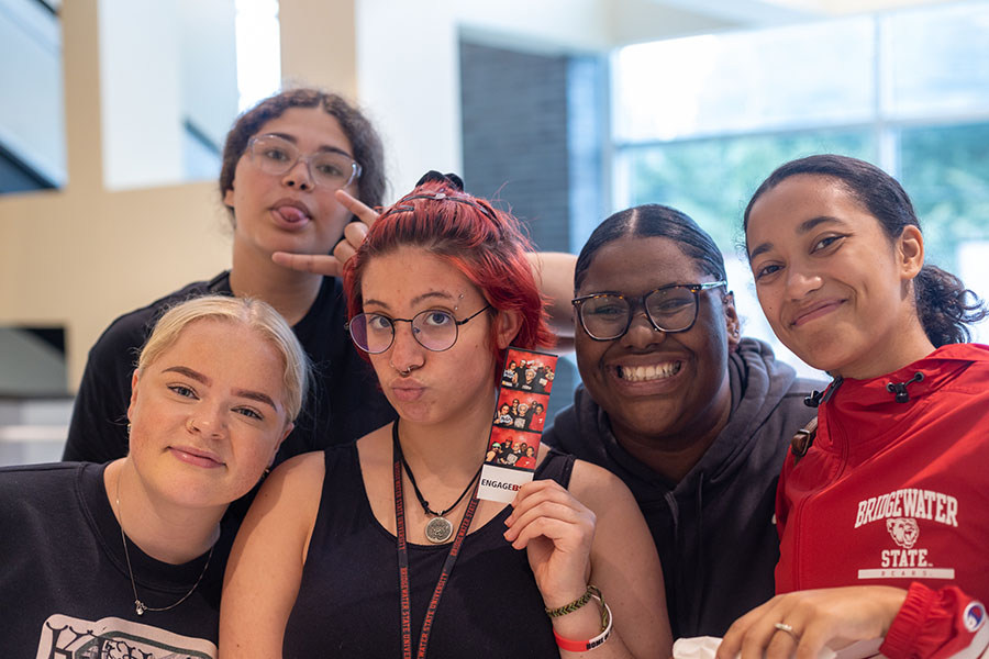 Five student leaders smile for the camera at the BSU involvement fair.