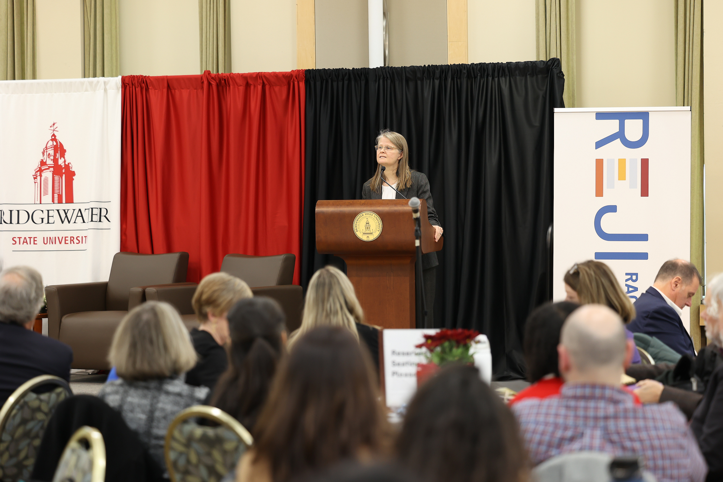 2024 REJI Summit - Sabrina Gentlewarrier at the podium