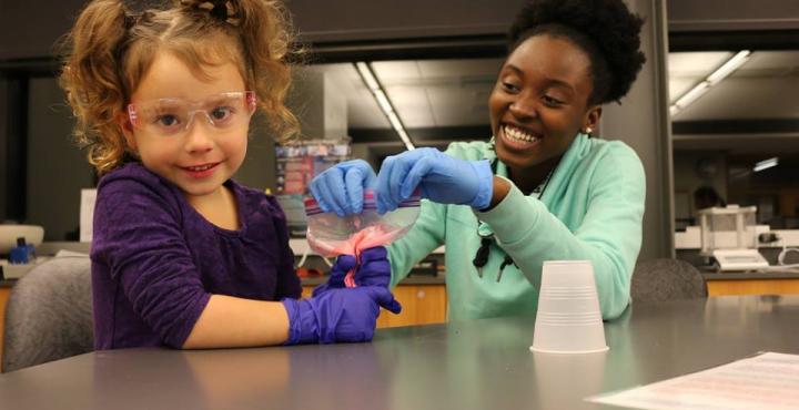 A kid and her teacher in the lab!