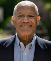 headshot photo of BSU Trustee Francis Giles wearing blue button up shirt and blazer