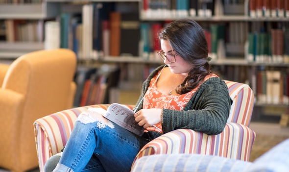 student reading in Maxwell Library