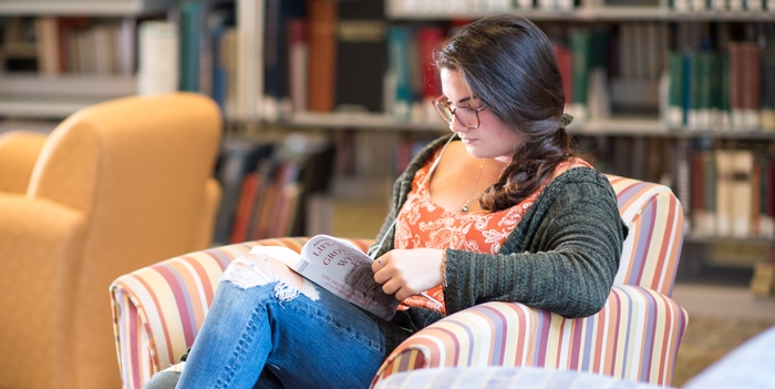 student reading in Maxwell Library