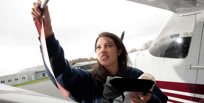 BSU Aviation student with airplane