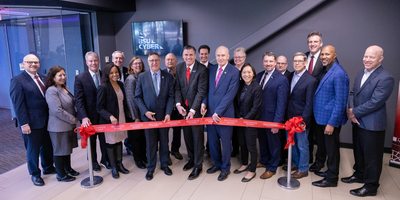 Officials cut a red ribbon outside of the new cyber range.