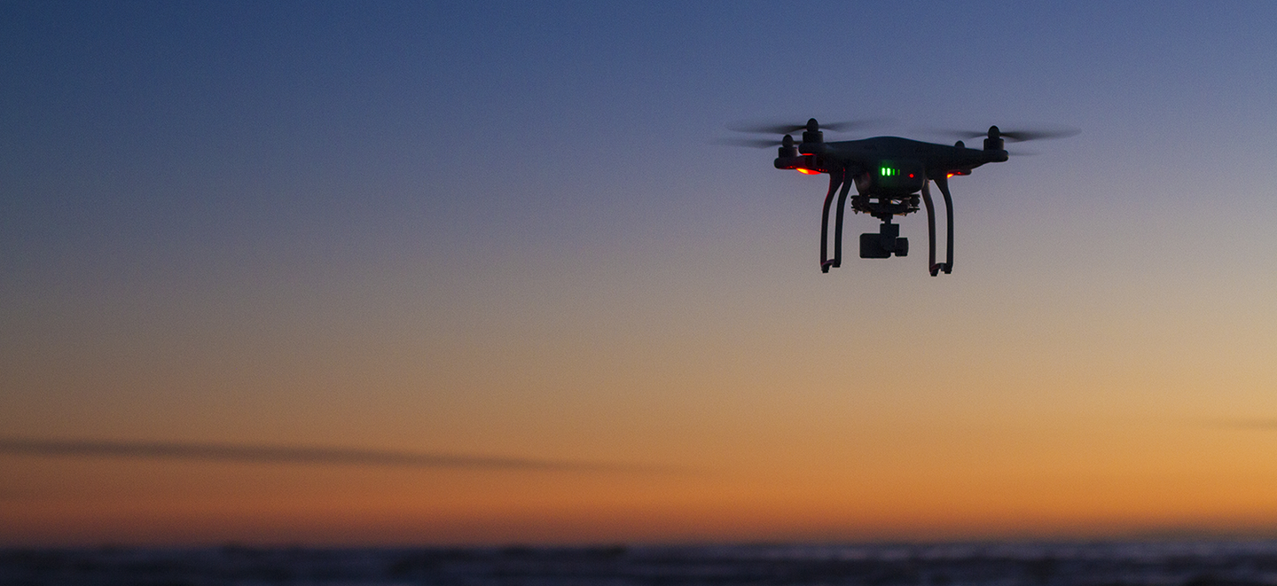 Drone flying at sunset