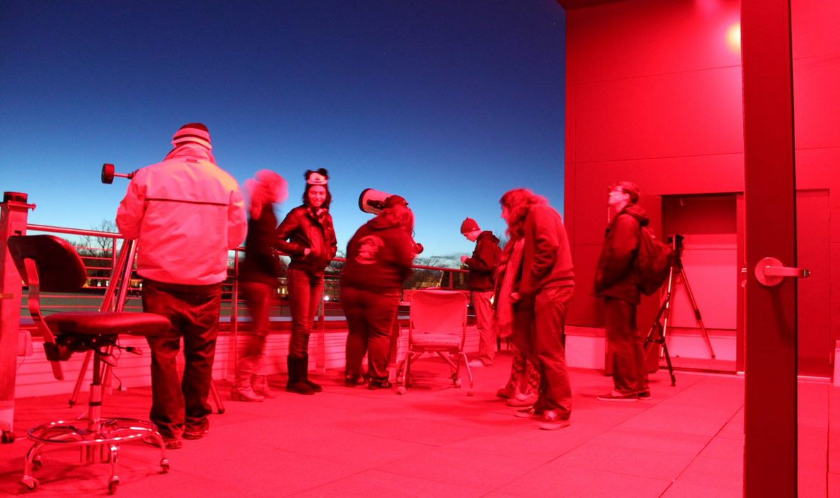 people on observatory deck in evening