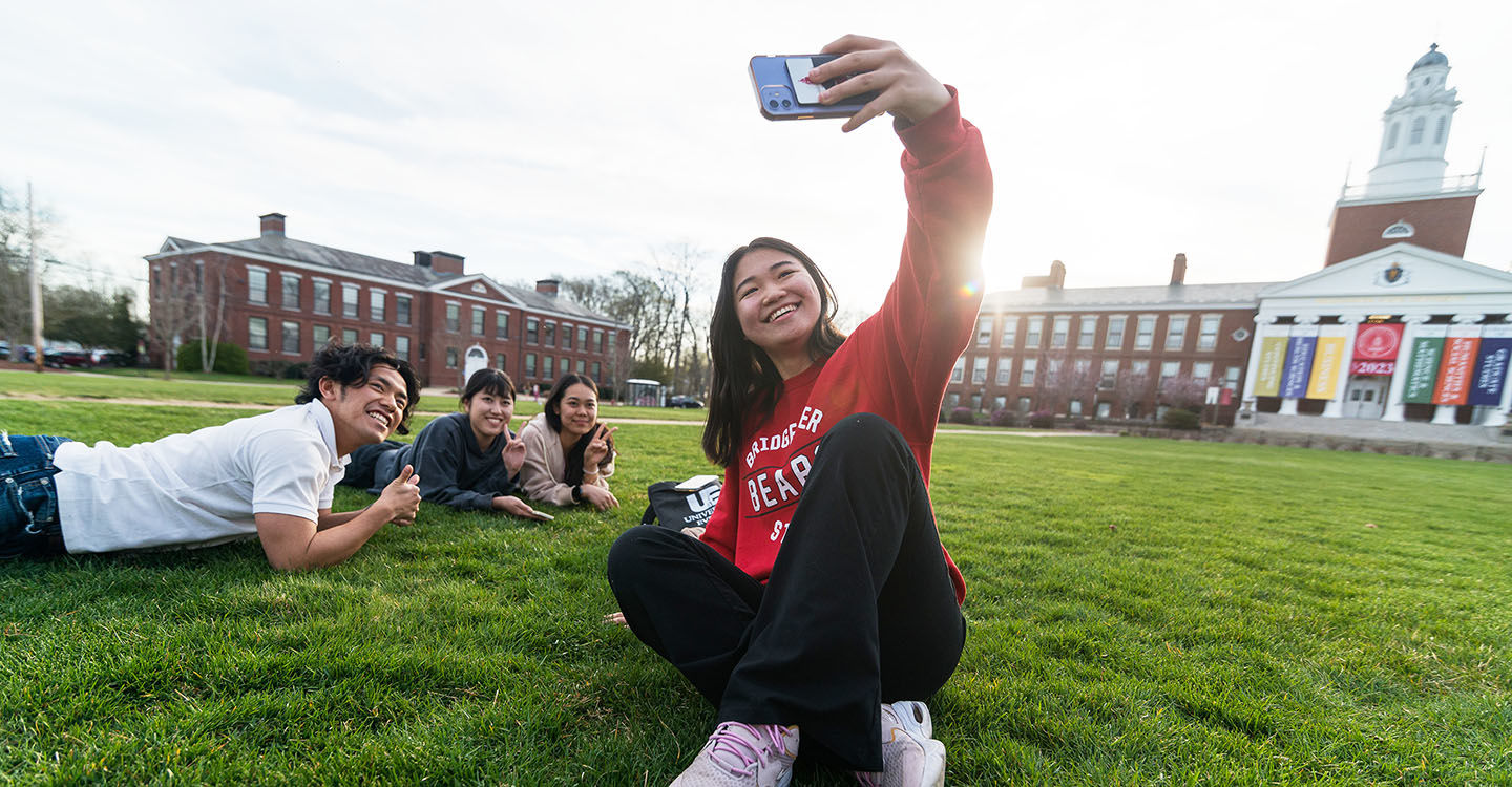 Four students taking a selfie on the Boyden Quad