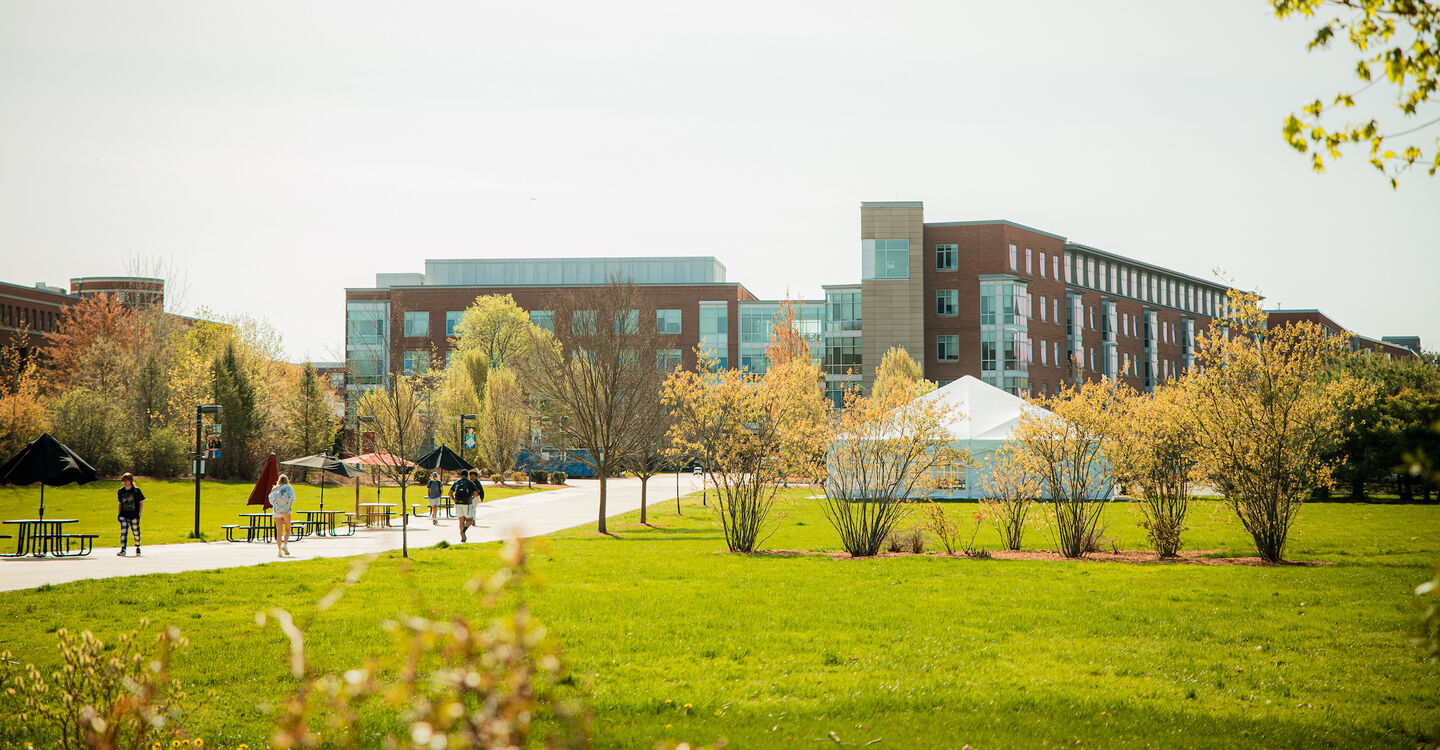 Students walking on the pathway in University Park toward the dorms