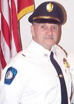 Headshot of Raymond Wise wearing a police uniform.