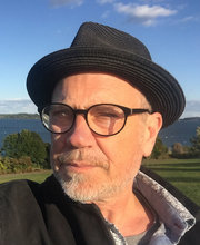 James Edwards headshot photo with lawn and ocean in background