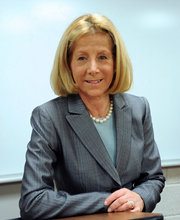 Dr. Phyllis Gimbel at the podium in a classroom