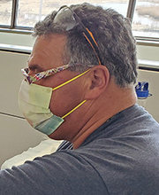 Chris Greim, '22, administering a vaccine as a clinic volunteer
