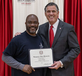 Derrick Thorpe receiving an Employee Achievement Award from BSU president Fred Clark
