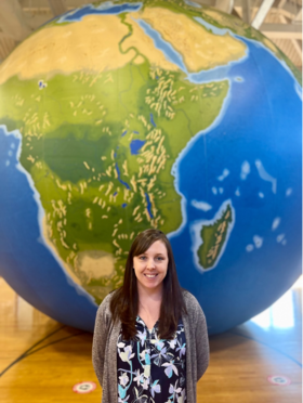 Courtney Sutcliffe in front of a giant inflatable globe