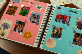A close up of two semester recap scrapbook pages with many photos pasted on them.