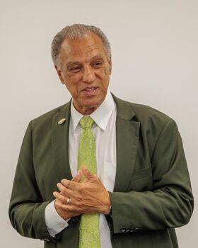 Portrait of Dana Mohler-Faria in front of a white background