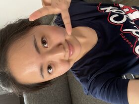 Smiling woman in a Red Sox t-shirt