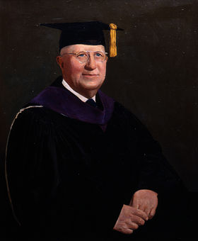 Painting of John Kelly wearing a graduation cap and gown