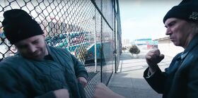 One man pretends to punch another man