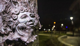 A sculpture of a nymph near the Maxwell Library