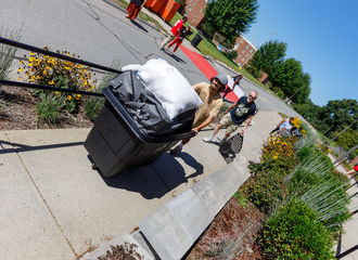 Students pushes cart during move in days