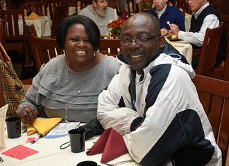 Parents smiling at family brunch