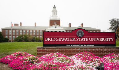 Bridgewater State University sign in front of a building with a cupola