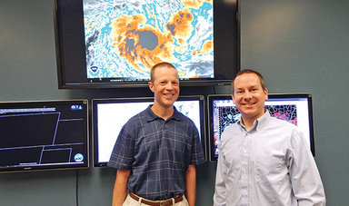 Dr. Phil Klotzbach, ’99 with his colleague  Dr. Michael Bell