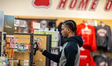 A student browses for merchandise in the bookstore.