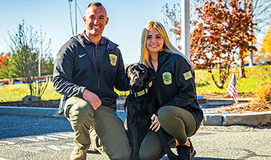 Sarah Carlozzi with BSUPD Captain Ryan Tepper and Outreach Dog Zach