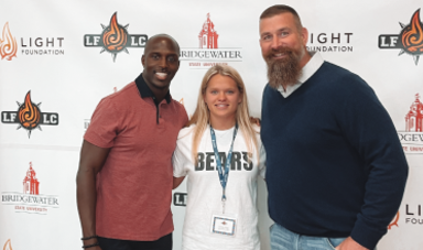 Devin McCourty, Caroline Tripp and Matt Light pose for a photo