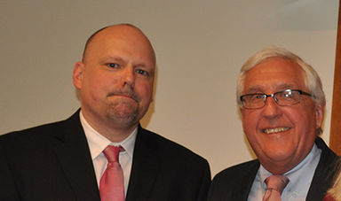 Brian Frederick and Michael Kryzanek stand for a photo.