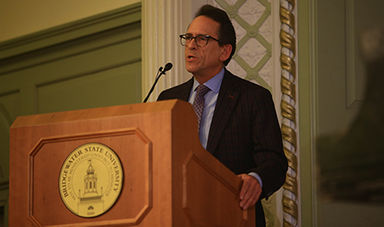 Louis Ricciardi speaking at a podium