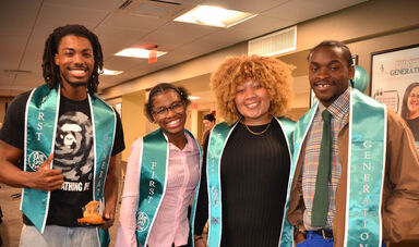 a group of 4 BSU students smiling and wearing First Gen stoles
