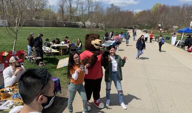 Students posing with BRISTACO at the Earth Day Fair