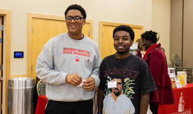 Two students smiling for the camera at the Global Engagement Day celebration