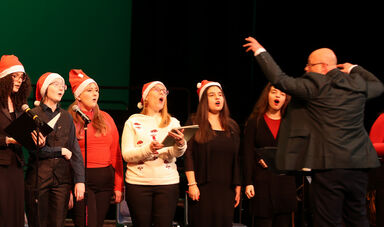 Stratos Bonos conducts a chorus.