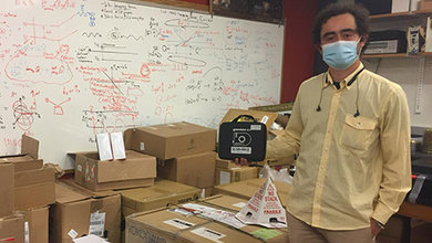 Dr. Samuel Serna with photonics equipment