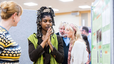 BSU student presenting research at spring symposium