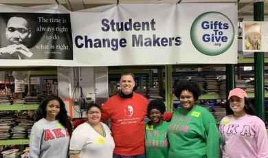 President Clark, center, with volunteers at Gifts to Give