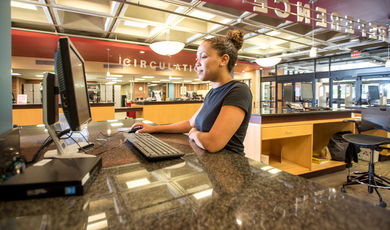 Student in the Maxwell Library
