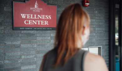 Student walking into Wellness Center