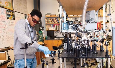 A student demonstrates photonics